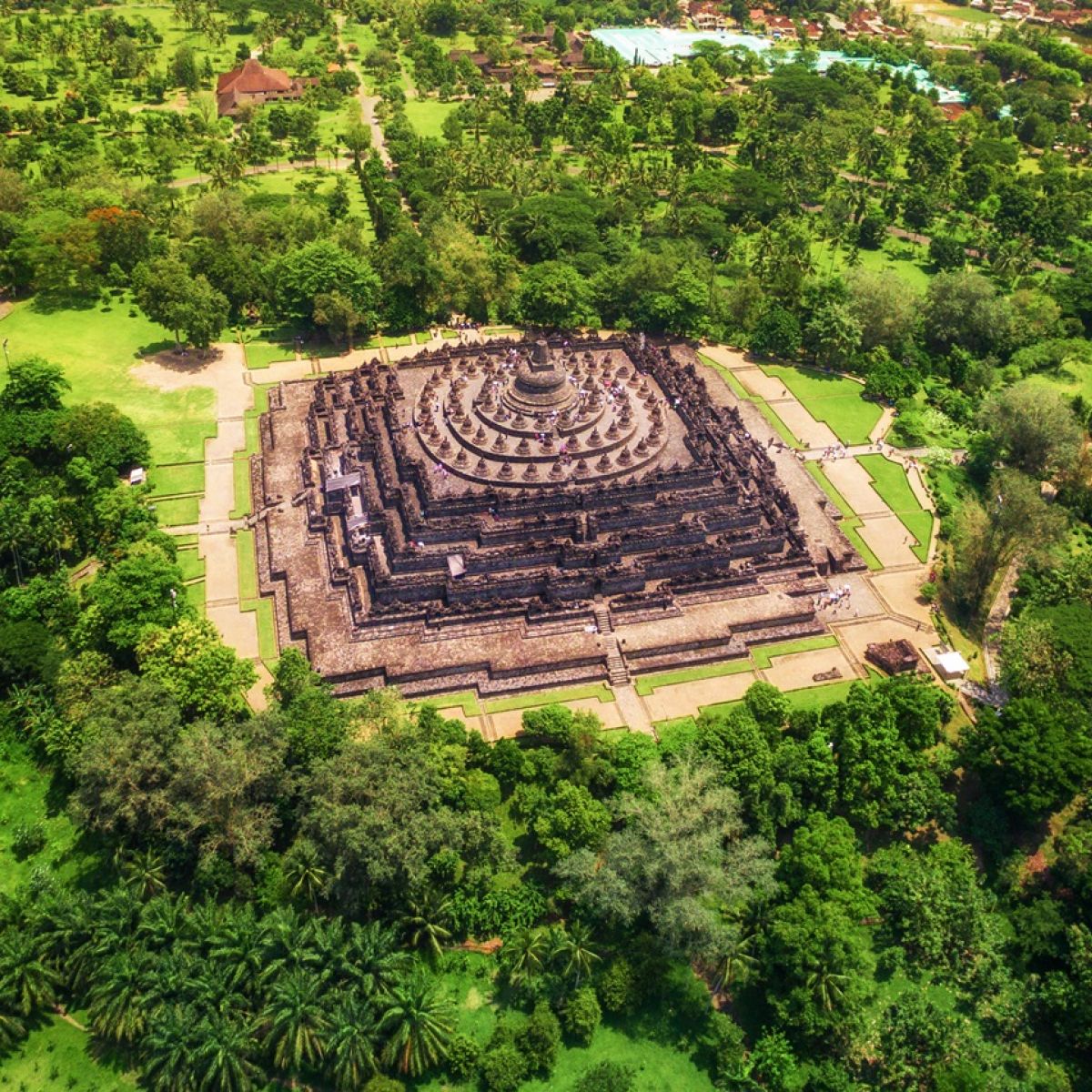 Aerial top-down view of Borobudur Temple showing its nine stacked stone platforms