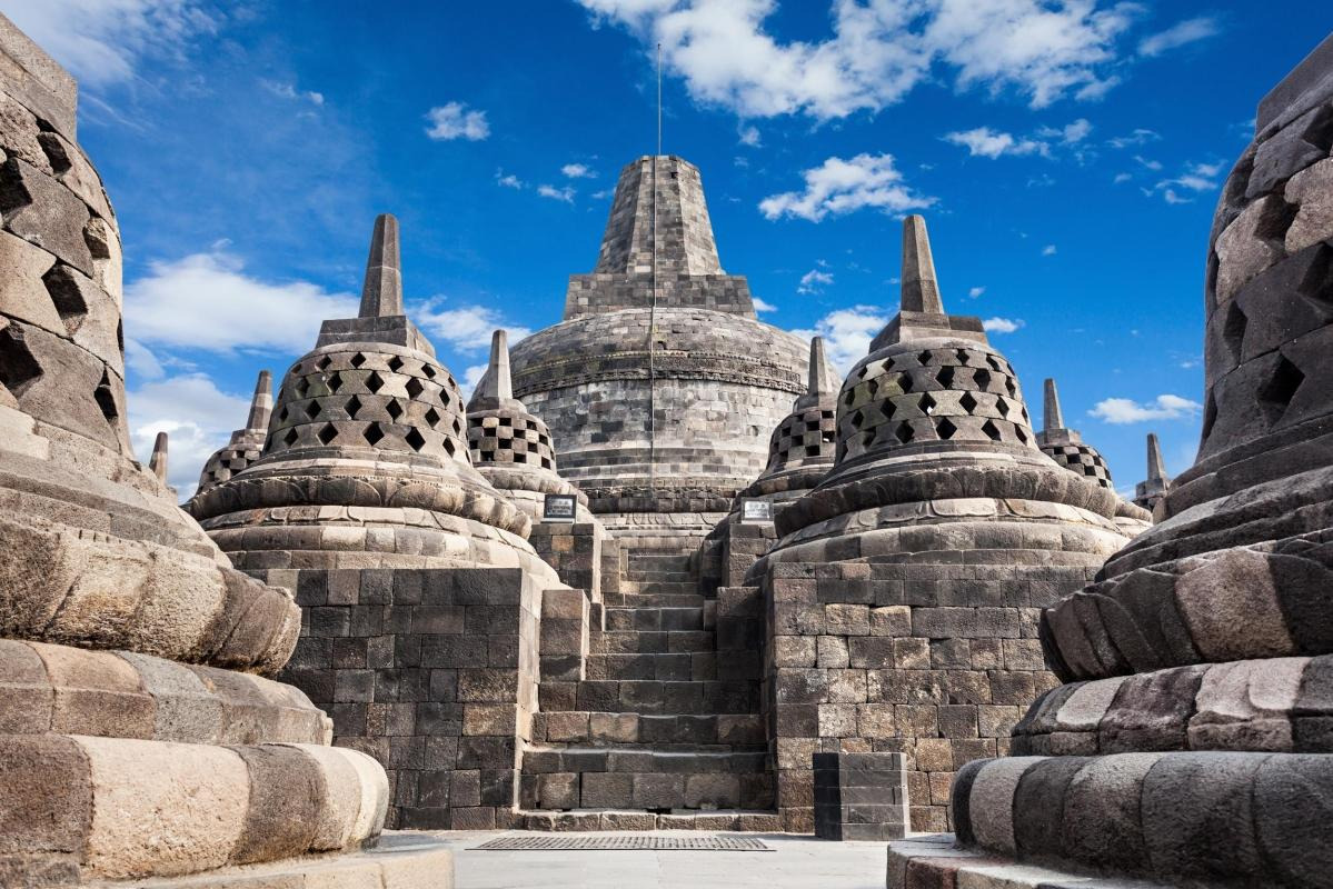 The large central stupa at the summit of Borobudur surrounded by the perforated stupas
