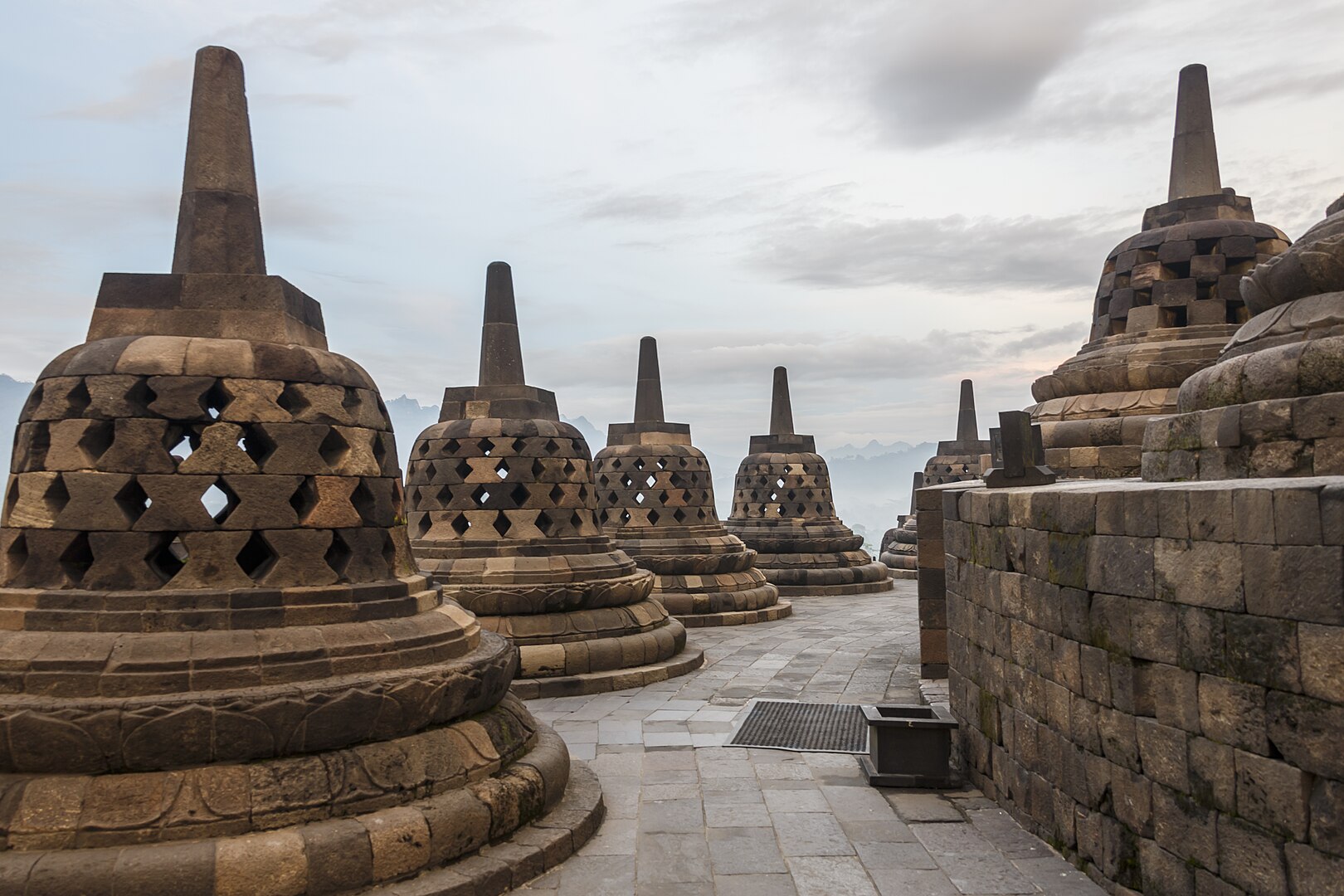 The seventy-two perforated stupas surrounding the central stupa on the upper terraces