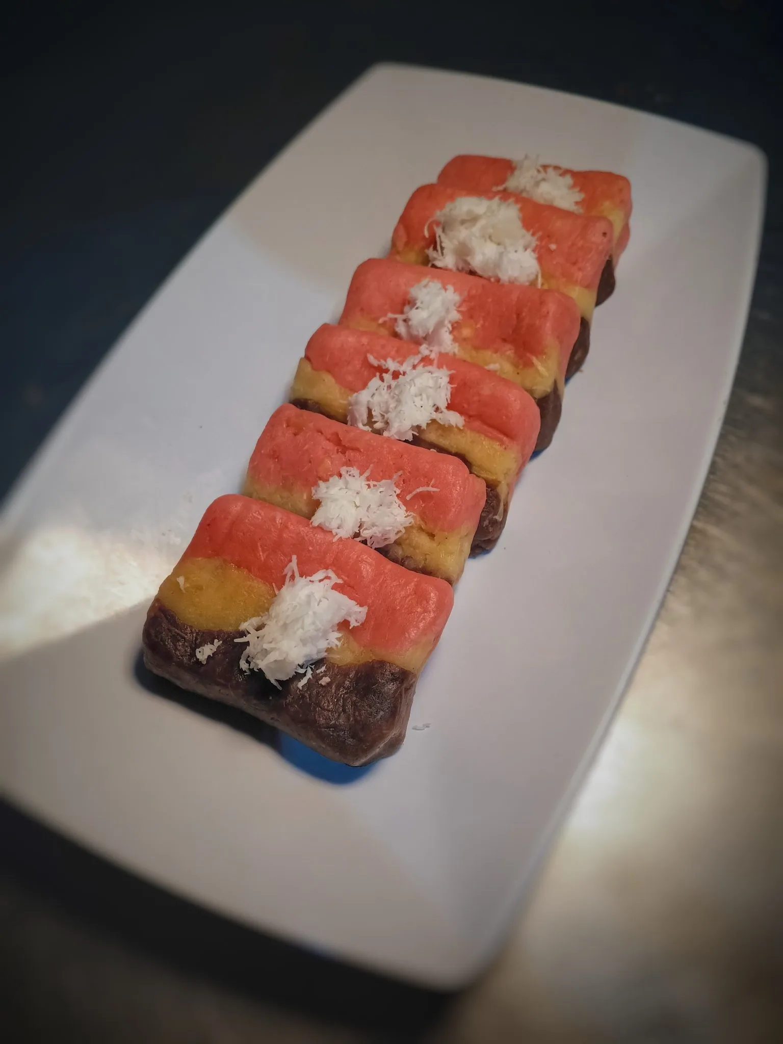 Three colourful pieces of Getuk Magelang, a local cassava dessert