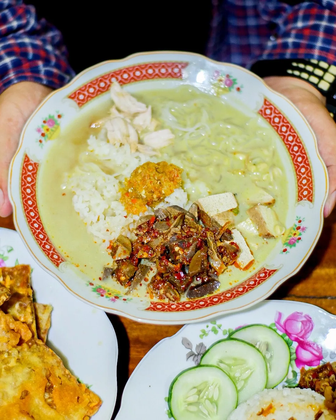 A generous bowl of Nasi Lesah with rice and soup served together