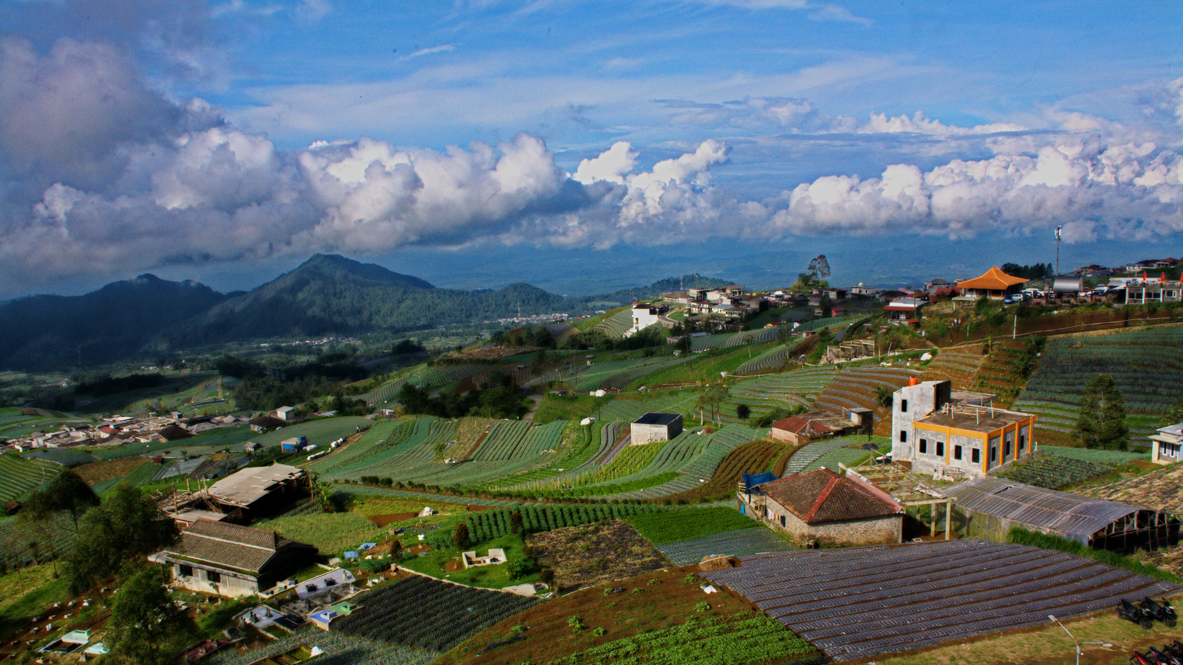 Hillside settlement and cultivated landscape at Nepal Van Java in Dusun Butuh
