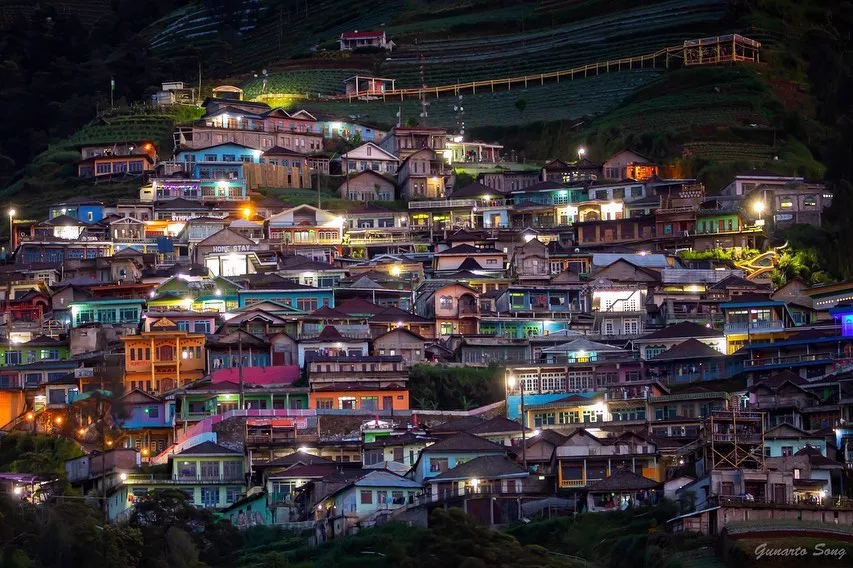 Panorama of the terraced hillside at Nepal Van Java with Mount Sumbing in the distance
