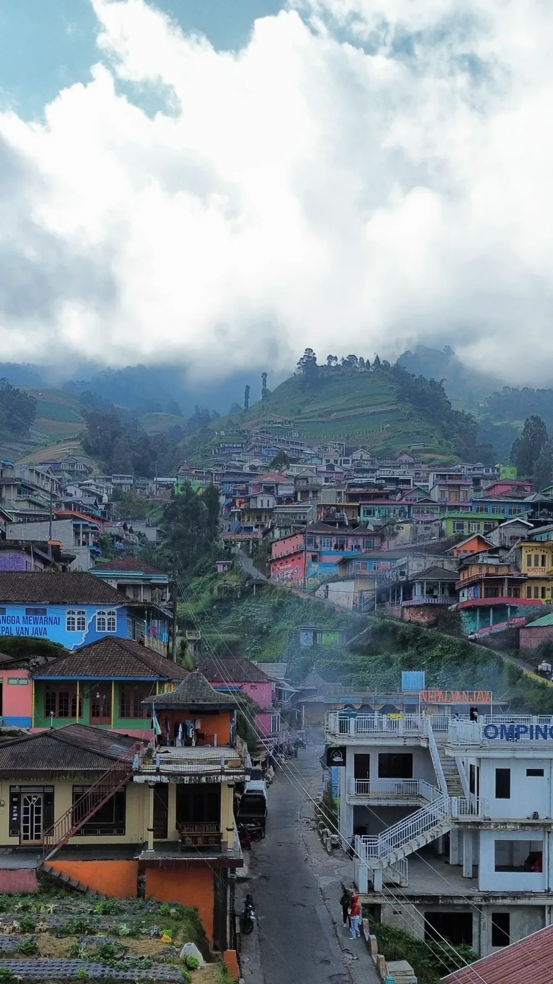 Phone wallpaper of a high viewpoint over the village and valley of Dusun Butuh